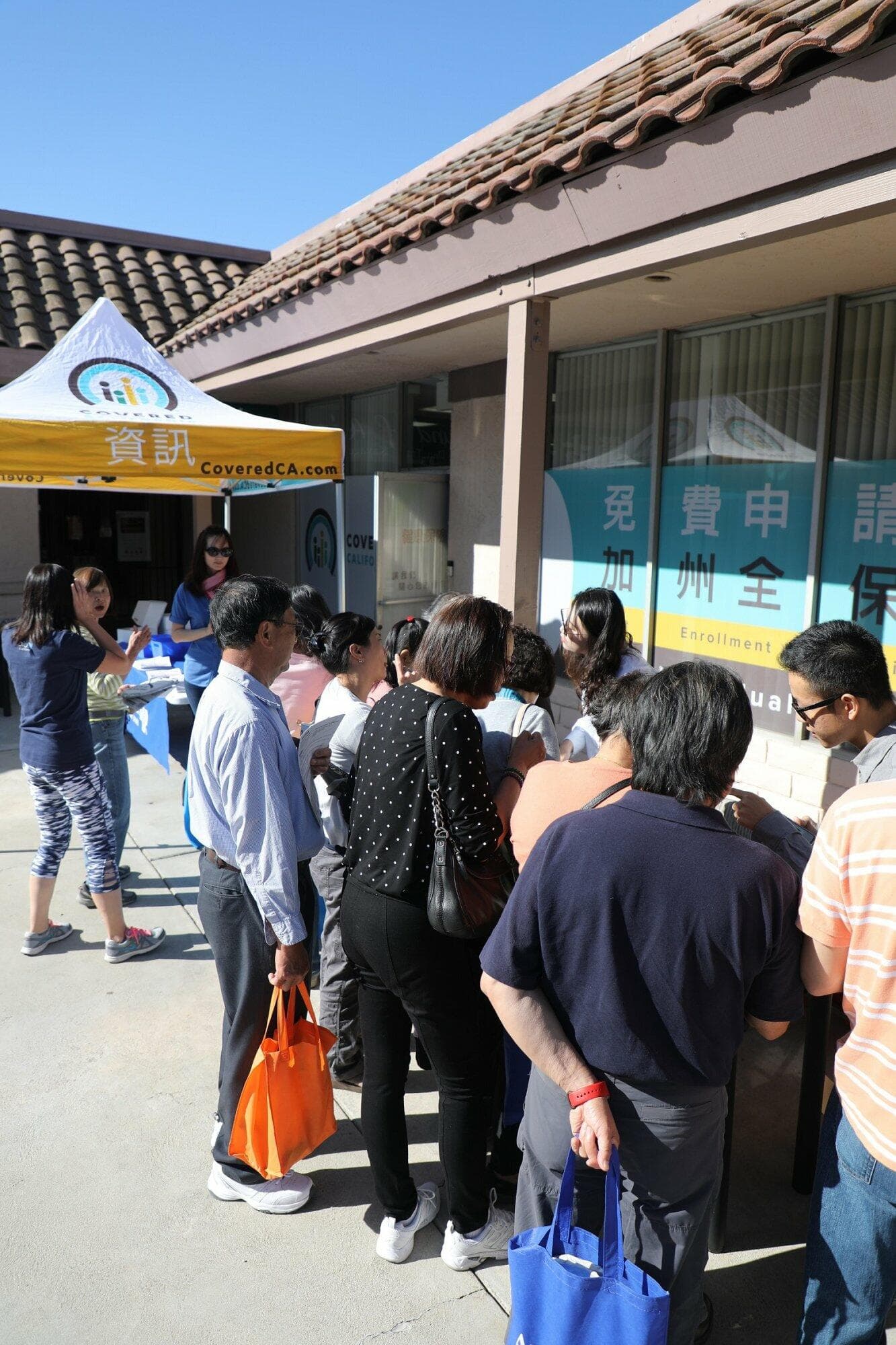 Attendees line up in the plaza at KCAL's 2020 open enrollment health fair