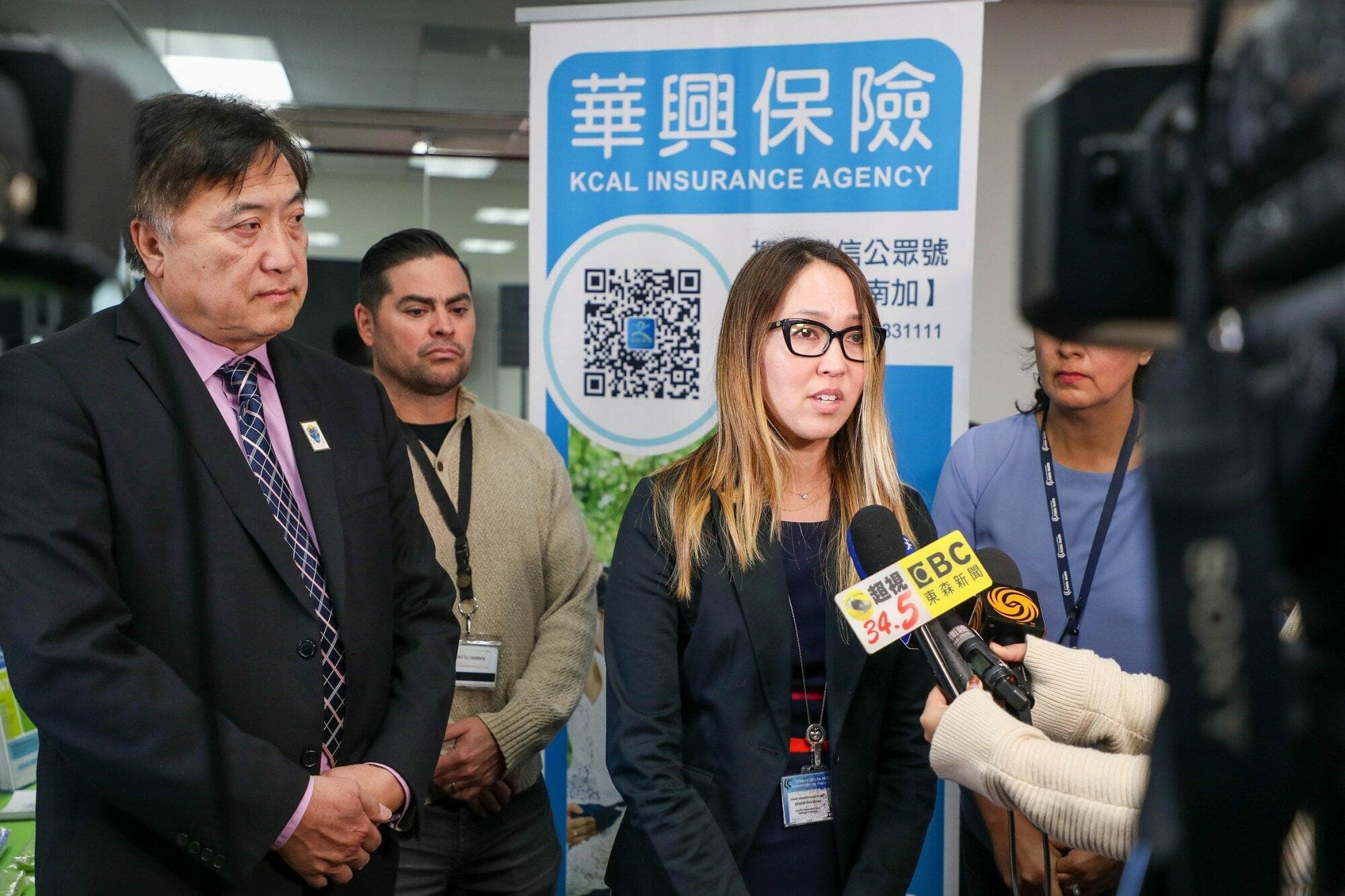 A Los Angeles County Public Health representative answers reporters' questions at the seminar