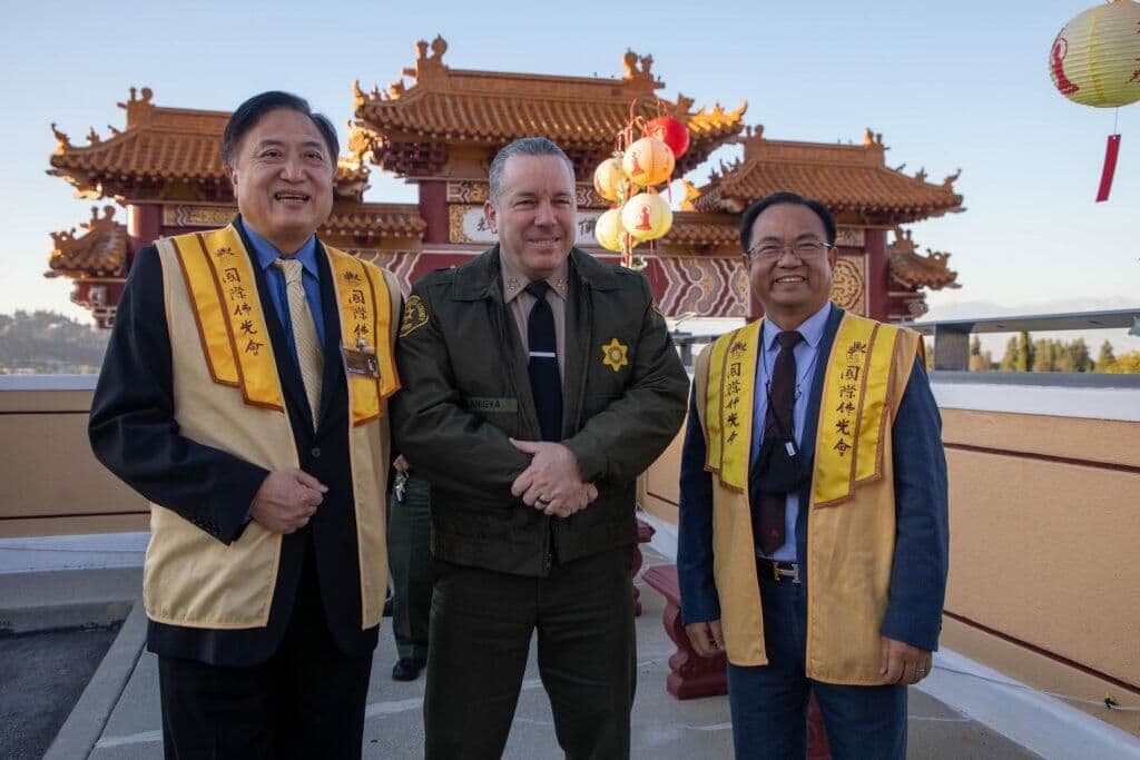 Kenny Chang, Daniel Deng and LA sheriff