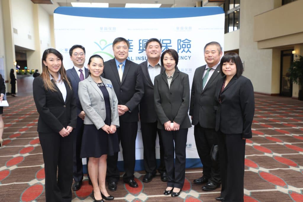 Speakers and KCAL representatives pose in the hotel lobby at the 2018 Seminar for Business Owners